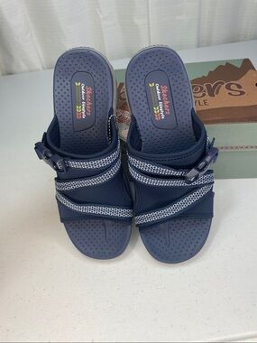 Skechers women’s Navy and White Slip-On Sport Sandals